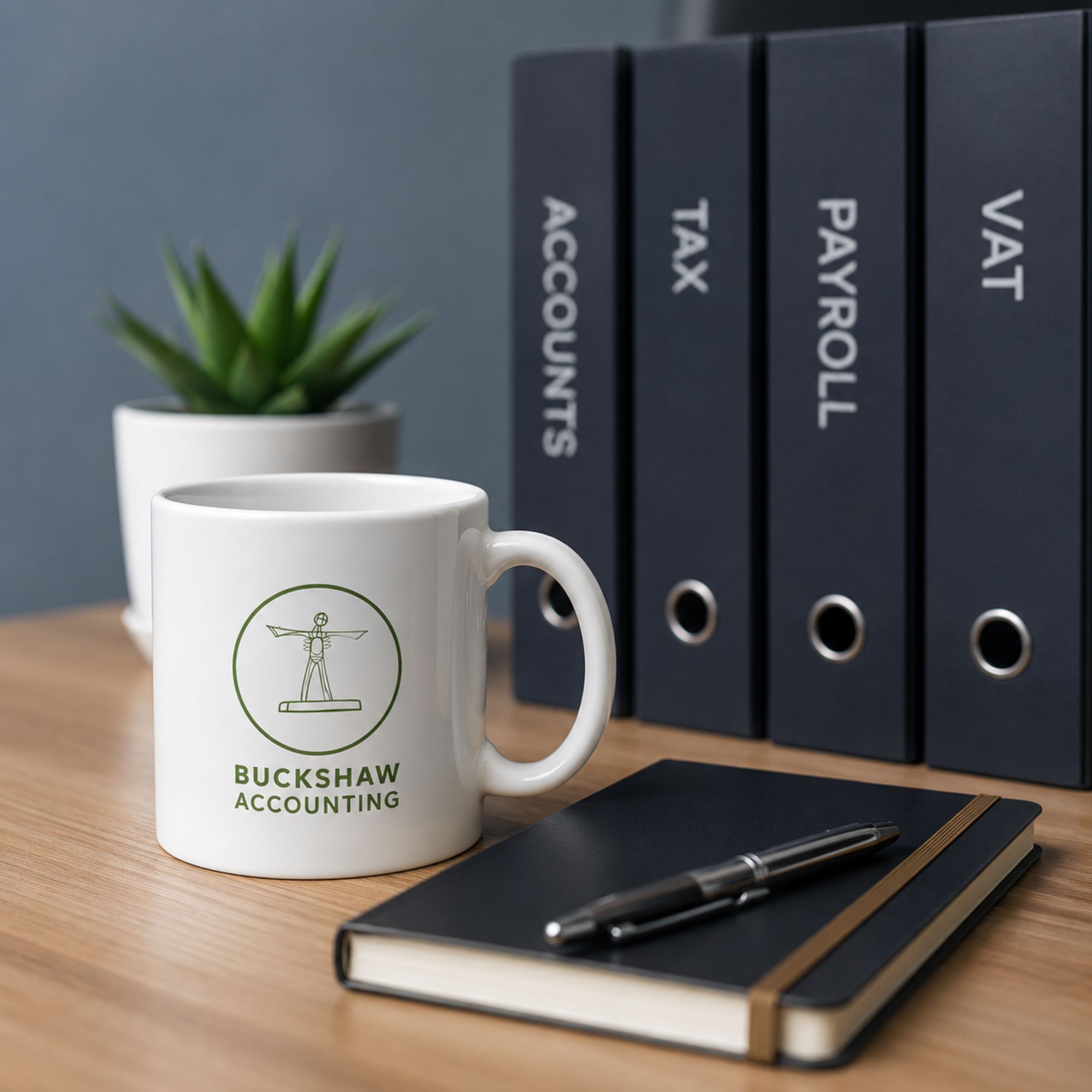 Buckshaw Accounting branded mug beside Accounts, Tax, Payroll and VAT folders